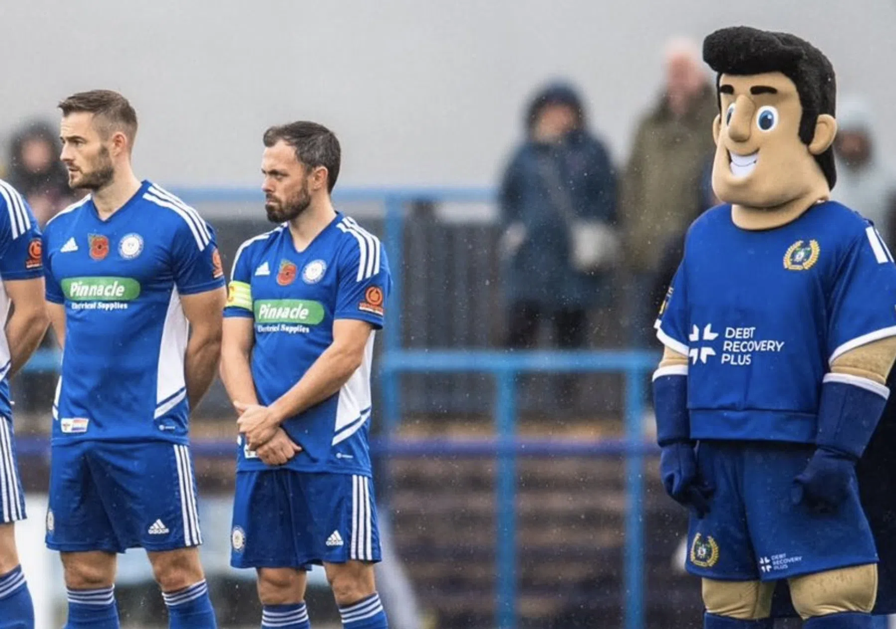 De akelige werkelijkheid achter de mascottegrijns